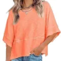 Close-up detail of the casual loose bell-sleeve top showing neck and sleeve design. - Orange