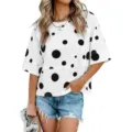 Close-up detail of the casual white polka dot short sleeve T-shirt and denim shorts outfit. - S / Tops / Polka Dot Print