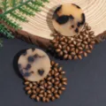 Chic boho earrings featuring round tortoise shell resin pieces and intricate wooden bead drops. - Leopard Print Dark Coffee Rice Bead Earrings