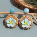 Chic resort style blue plumeria flower woven rattan dangle earrings with resin bead stud decor. - Plumeria Blue