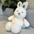 Simpatico coniglietto di peluche bianco morbido con cinturino arancione, bambola regalo per bambini. - Stile Coniglio Bebe