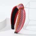 Serre-tête tressé coloré avec nœud large accessoire de cheveux style ethnique tendance. - Serre-tête noué rouge