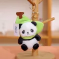 Llavero de peluche de panda lindo con variante de sombrero de hoja verde, colgante de bolsa suave. - Panda con gorro de plátano 11 cm