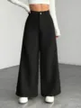 Close-up detail showcasing the premium ribbed texture and high-waisted fit of the casual trousers. - M / Black
