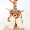 Cute brown plush teddy bear keychain with elegant bow tie, fluffy bag pendant for daily use - Bear Bella Pendant - Brown & Yellow