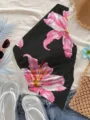 Vue détaillée du haut asymétrique estival pour femme avec motif floral de lys roses. - XS / Noir