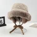 Women's quilted winter bucket hat with plush earflaps and cute knitted bow ties. - Beige