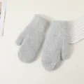 Detailed view of winter thick warm grey knitted mittens, soft woolen material for cold weather. - Light Gray