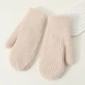 Detailed close-up of thick knitted mittens showcasing soft fuzzy texture and warm design. - Beige