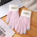 Close-up of pink knitted winter touchscreen gloves with white plush cuffs and cute lace label. - Touchscreen Split Finger / Pink