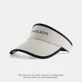 Detail view of the summer sun visor hat, showing the black brim binding and logo. - Candy Color Empty Top Hat / White