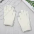 Detail view of white knitted winter gloves with touch screen fingertips for warm daily use. - One Size / White