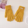 Detail shot of yellow knit touchscreen winter gloves with ribbed cuffs and convenient slots. - Candy Color Cuff Label Split Finger / Yellow