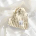 Cozy white cable knit beanie winter warm thick slouchy cap for women casual daily wear. - Beige