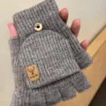 Grey knitted convertible half-finger gloves for women, warm winter fingerless mitten design. - Wool Cuff Badge Flip / Light Gray