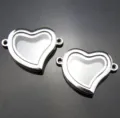 Detail view of silver heart floating locket charm connectors for DIY jewelry making. - Silver Heart Shape