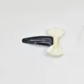 Chic black metal snap hair clip featuring an elegant cream white ribbon bow for sweet girls. - Off White