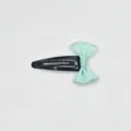 Detail view of a cute mint green ribbon bow snap hair clip, sweet girl hair accessory. - Cyan