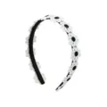 Detailed shot of sweet white daisy lace headband on black band, stylish accessory for girls. - Black