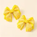 Detail view of yellow checkered hair clips featuring cute fabric bows, flowers, and pearl accents. - 2 Pcs/Set / Yellow