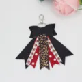 Cute cheer bow keychain with football and leopard print ribbons, perfect stylish bag charm accessory. - Black Glitter Football Style (02#)