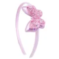 Détail serre-tête papillon à paillettes roses, gros plan accessoire cheveux scintillant. - Rose