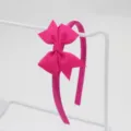 Vue detaillee du bandeau noeud ruban rose vif texture fine et joli double noeud. - Serre-Tête Nœud / Rose Vif (19#)