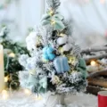 Mini tabletop flocked Christmas tree with bows and warm lights for holiday home decor variant - Sky Blue 30cm