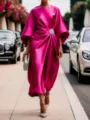 Detail view of an elegant fuchsia satin dress featuring a stunning pearl brooch accent on street. - XS / Dresses / Rose Red