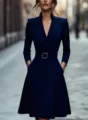Detail view of the elegant navy blue V-neck long sleeve dress featuring a stylish waist belt. - S / Dresses / Navy Blue