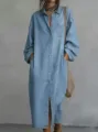 Close-up detail of the light blue denim shirt dress showing button placket and pocket design. - S / Dresses / Light Blue