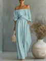 Detail view of the light blue off-shoulder top and wide leg pants set showcasing fabric. - S / Top And Bottom / Sky Blue