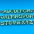 Green rhinestone alphabet letters detail view, sparkling DIY charm accessories for bracelets. - Letter A / Green