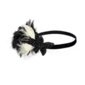 Detailed close-up of handmade feather rhinestone headband for vintage party and prom wear. - Black and White