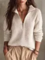 Close-up detail of women's half-zip knitted sweater with ribbed texture and chic collar style. - S / Tops / White
