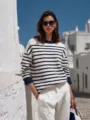 Chic striped knit sweater detail in Mediterranean street style, cozy textured fabric. - S / Navy Blue