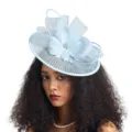 Close-up detail of elegant light blue mesh fascinator hat, floral and loop design for women. - Light Blue