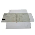 Detail view of velvet jewelry roll organizer featuring multiple necklace snap holders inside. - 16 Snaps