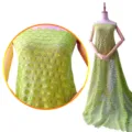 Cotton embroidered lace fabric detail view, green hollow floral pattern for sewing apparel. - Green