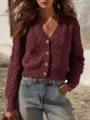 Detailed view of the burgundy cable-knit cardigan featuring a V-neck and chic button front. - S / Tops / Burgundy