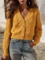 Closeup of the yellow cable-knit V-neck cardigan, showing delicate texture and buttons. - S / Tops / Yellow