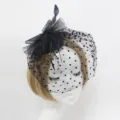 Black mesh bridal fascinator with polka dots and feathers, elegant wedding hair clip accessory. - Black