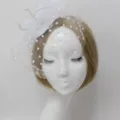 White bridal mesh fascinator hat with polka dot veil and feathers for wedding photo shoot SKU. - White