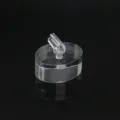 Clear acrylic ring display stand detail shot showing transparent clip and oval base structure. - Transparent Oval Base