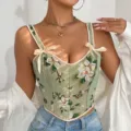 Detailaufnahme eines eleganten französischen Blumenkorsetts mit Schleifen und zarten Trägern. - S / Dunkelgrün