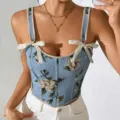 Vista detallada del top corsé de jacquard floral francés con tirantes de lazo. - S / Tops / Azul claro