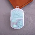 Transparent box with light blue paper clips and binder clips set for office and school use. - Paper Clips + Binder Clips / Green