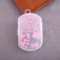 Joli kit de papeterie rose avec trombones, punaises et pinces dans boîte transparente. - Trombones + Pinces + Punaises / Rose