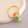 Lindo mini llavero de termo con estampado de oso y correa amarilla para mochila. - Llavero de Letra Naranja