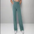 High-waisted casual straight-leg trousers feature multiple front pockets and buttons. - S / Bottoms / Malachite green